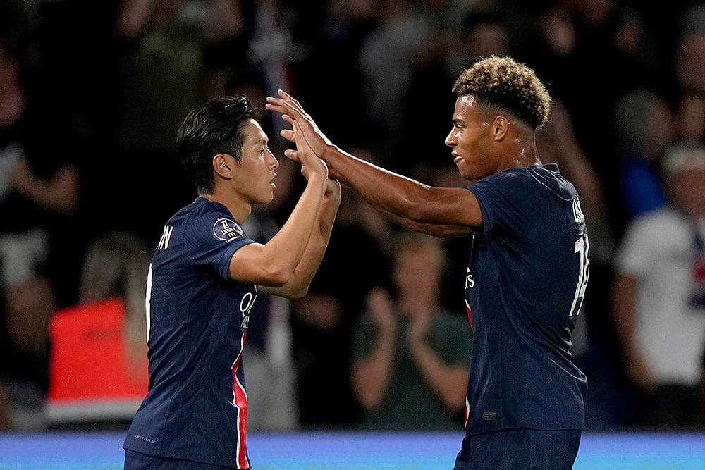 | Photo: AP/Thibault Camus : PSG's Lee Kang-in celebrates with teammate Desire Doue, right, after scoring his side's sixth goal in Ligue 1.